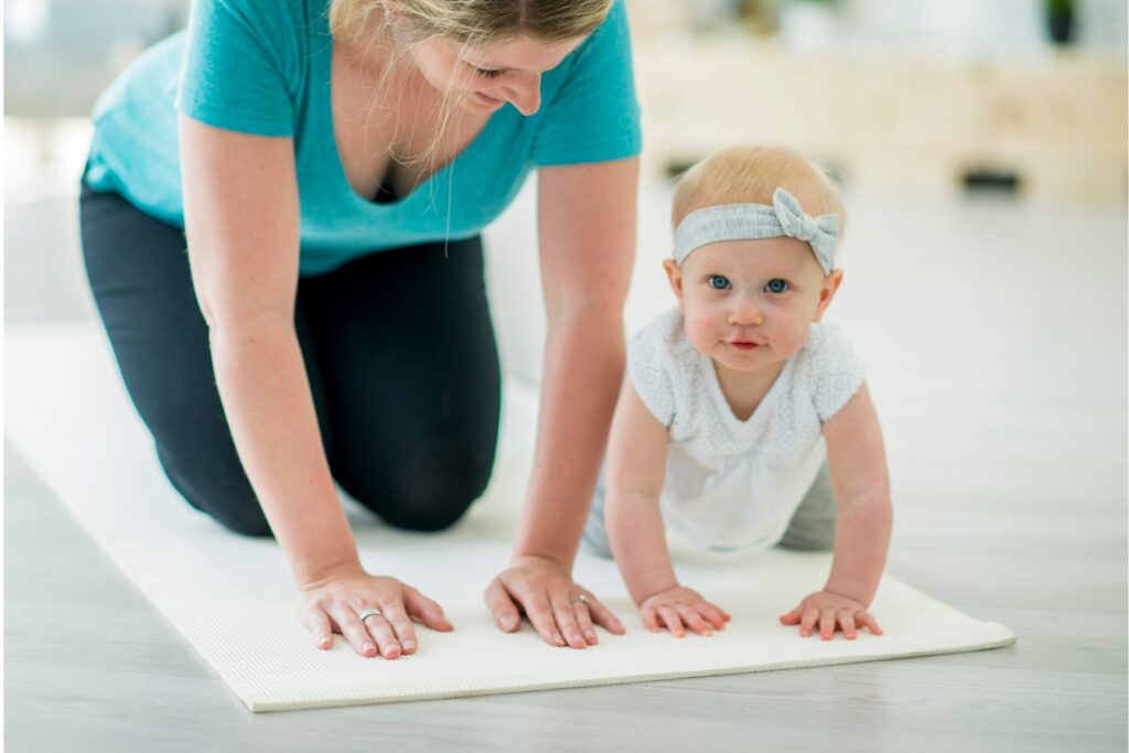 Therapist and baby practicing crawling