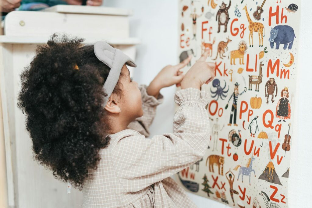Child playing with letters on a board